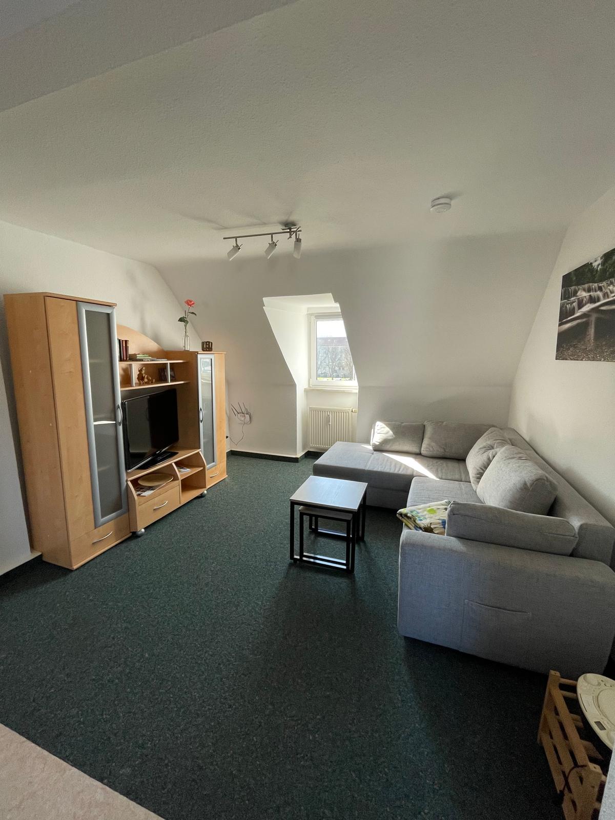 Wohnzimmer der Gästewohnung Grün